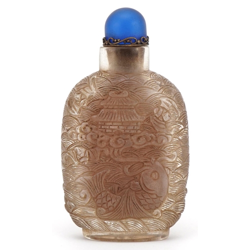 180 - Chinese glass scent bottle moulded with fish, dragons and birds, 9.5cm high