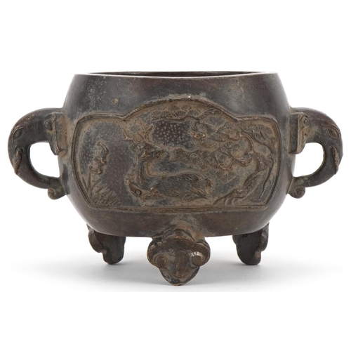 354 - Chinese bronze three footed censer cast with wild animals and elephant head handles, 16cm wide