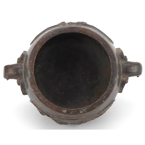 354 - Chinese bronze three footed censer cast with wild animals and elephant head handles, 16cm wide