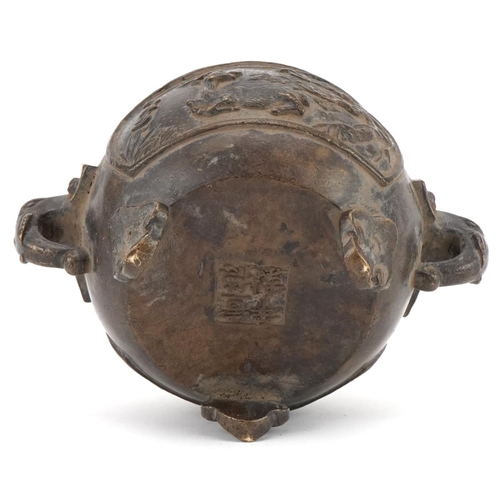 354 - Chinese bronze three footed censer cast with wild animals and elephant head handles, 16cm wide