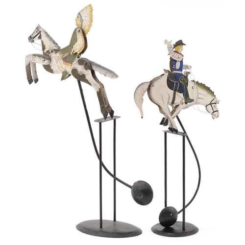 586 - Two vintage folk art metal pendulum figures in the form of a cowboy riding a horse and a Native Amer... 