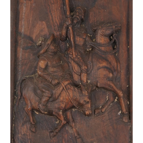 148 - Carved wooden plaque of Don Quixote, 63cm x 26cm