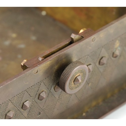 141 - Gothic bronze casket with rivets, strapping and side locking mechanism, 26cm wide