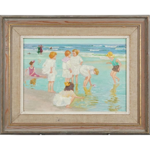 537 - Children playing in the sea, oil on board, bearing an indistinct signature, mounted and framed, 34cm... 