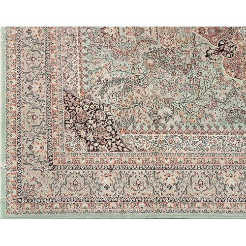 1032 - Super Keshan Turkish rug having an allover floral design onto a green and red ground, 300cm x 200cm