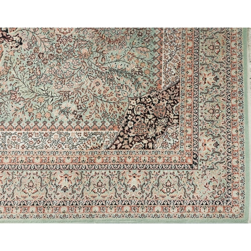 1032 - Super Keshan Turkish rug having an allover floral design onto a green and red ground, 300cm x 200cm