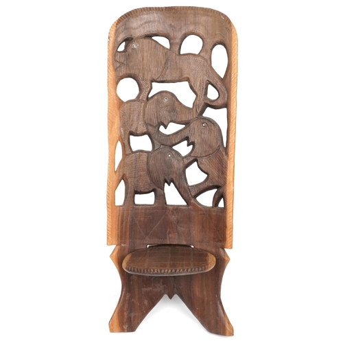 1019 - African folding occasional chair carved with elephants, 92cm high