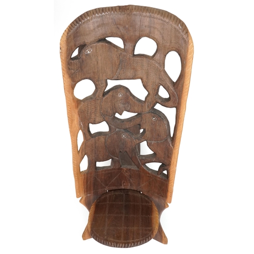 1019 - African folding occasional chair carved with elephants, 92cm high