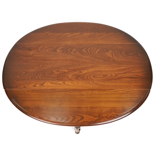 1002 - Ercol elm drop leaf coffee table, 49cm H x 42cm W extending to 92cm W x 106cm D