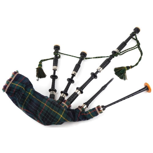 496 - Set of R G Lawrie Scottish bagpipes housed in a wooden case,