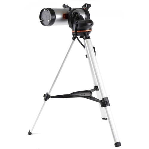 472 - Celestron 114LCM computerised telescope on tripod stand with box