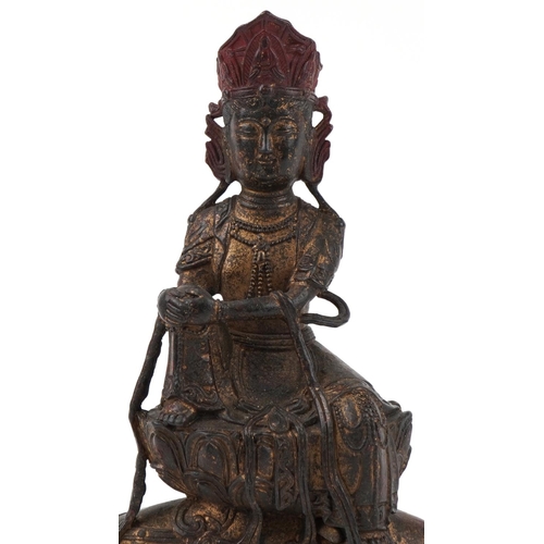 287 - Chinese partially gilt bronze figure of a Buddha riding a mythical beast, 32cm high