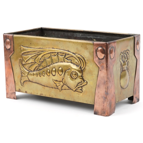 120 - L Rion Arts & Crafts brass and copper planter decorated with stylized fish, 19cm H x 34cm W x 16cm D