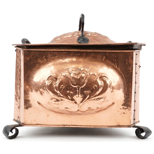 131 - Arts & Crafts triangular copper coal box with wrought iron strapping, feet and handles, decorated wi... 