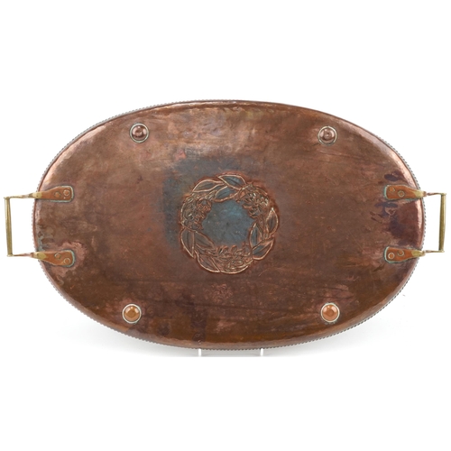 357 - Hugh Wallis Arts & Crafts copper and brass tray with stylized floral centre, impressed mark, 63cm in... 