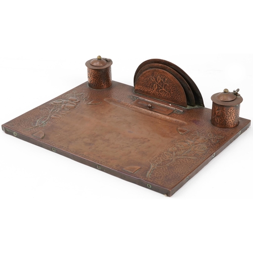 Arts & Crafts wooden and copper desk stand with inkwells embossed with flowers, 44cm x 34cm