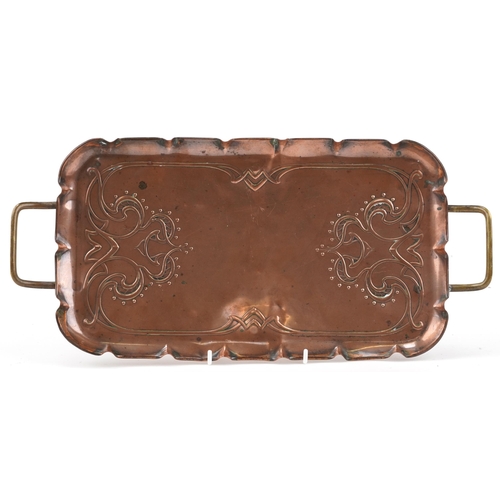 J S & S Arts & Crafts copper and brass tray with stylised decoration, 44cm in diameter
