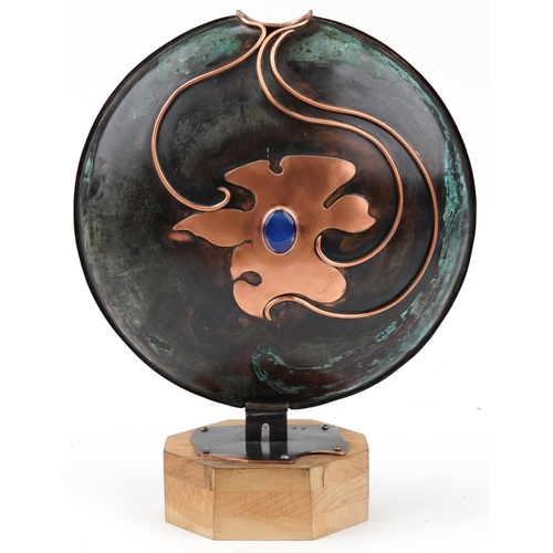 Sam Fanaroff stylised sculpture inset with blue stone and a glass roundel, impressed SF 2013, mounted on a wooden base, 47cm high