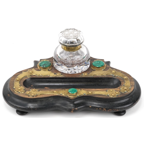 82 - Arts & Crafts wooden and brass inkwell inset with malachite and brass topped glass ink bottle, 33cm ... 