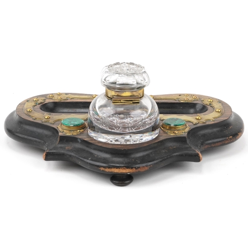 82 - Arts & Crafts wooden and brass inkwell inset with malachite and brass topped glass ink bottle, 33cm ... 