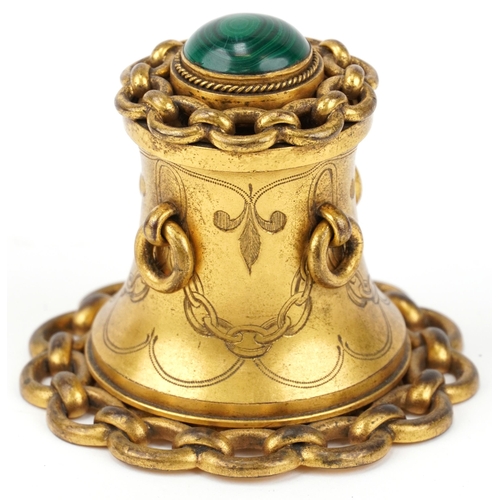 81 - Arts & Crafts brass inkwell with malachite cabochon and ring turned handles, 8cm high