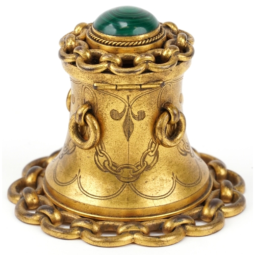 81 - Arts & Crafts brass inkwell with malachite cabochon and ring turned handles, 8cm high