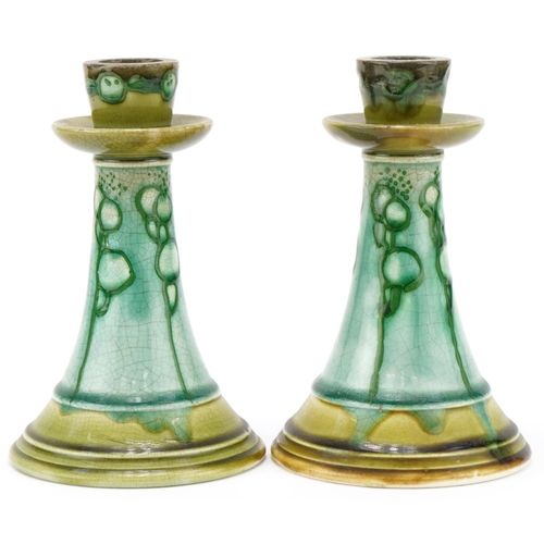 194 - Pair of Minton's Secessionist pottery candlesticks with stylized pattern each 18cm high