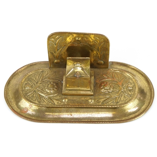 134 - Arts & Crafts brass inkwell decorated with stylized flowers, 30cm in diameter