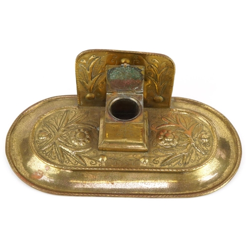 134 - Arts & Crafts brass inkwell decorated with stylized flowers, 30cm in diameter