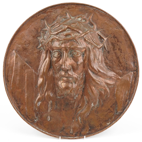 113 - Large Arts & Crafts copper wall plaque of Christ with crown of Thorns, 47cm high