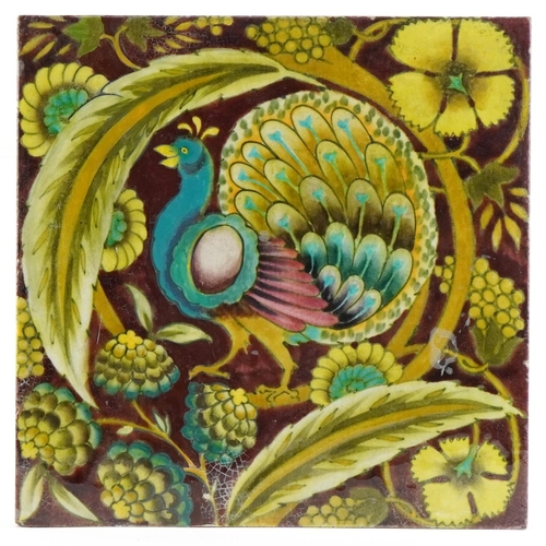 235 - Arts & Crafts William de Morgan style ceramic tile decorated with a peacock, 20cm in diameter