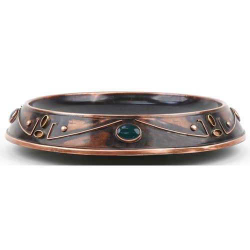 404 - Sam Fanaroff stylized copper dish inset with cabochon hardstones, impressed SF 009, 45cm in diameter