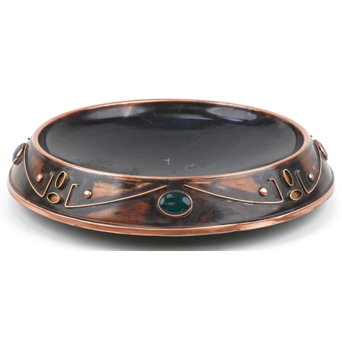 404 - Sam Fanaroff stylized copper dish inset with cabochon hardstones, impressed SF 009, 45cm in diameter