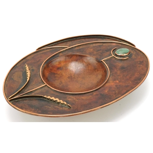 406 - Sam Fanaroff copper stylized dish inset with a cabochon stone, impressed SF, 37cm in diameter