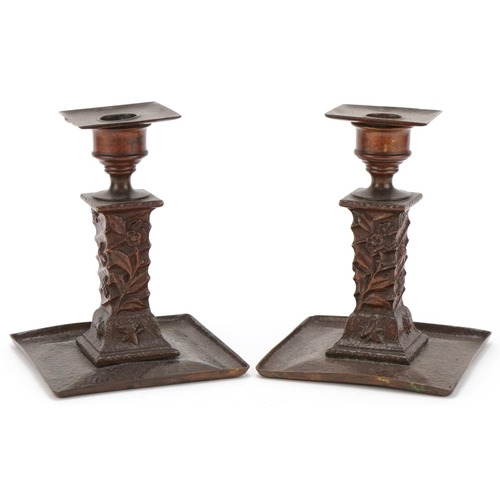 117 - Pair of Arts & Crafts coppered brass candlesticks decorated with insects, each  16cm high