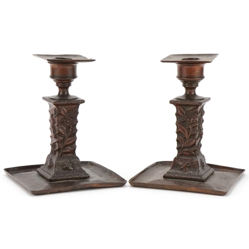 117 - Pair of Arts & Crafts coppered brass candlesticks decorated with insects, each  16cm high