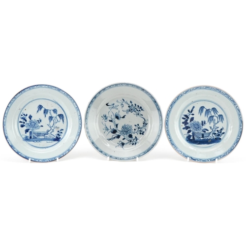 1110 - Three 18th century hand painted blue and white plates, two in the Willow pattern, one with flowers, ... 