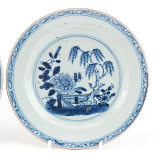 1110 - Three 18th century hand painted blue and white plates, two in the Willow pattern, one with flowers, ... 