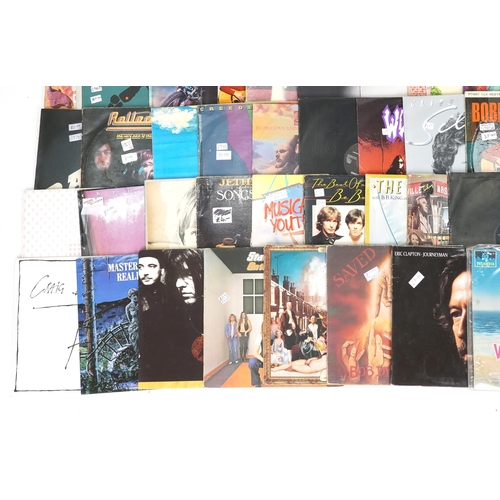 1474 - Vinyl LP records including Eric Clapton, Electric Light Orchestra, Status Quo, Billy Joel, Cliff Ric... 