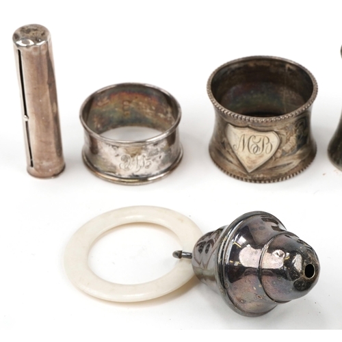 1272 - Silver and silverplate including a hand mirror embossed with Putti, dwarf candlestick, babies rattle... 