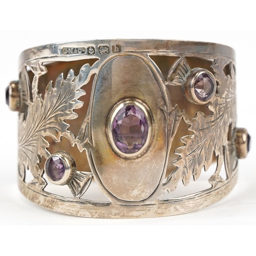 1082 - C M & Co, Edwardian Scottish silver thistle design napkin ring, set with amethyst stones, Birmingham... 