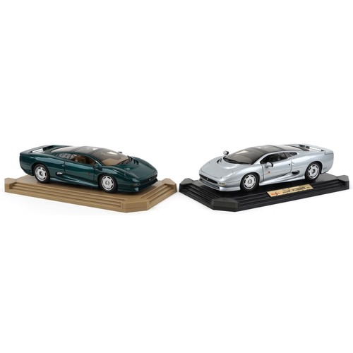 2324 - Two Maisto Jaguar XJ220 1:12 scale diecast vehicles on display stands,