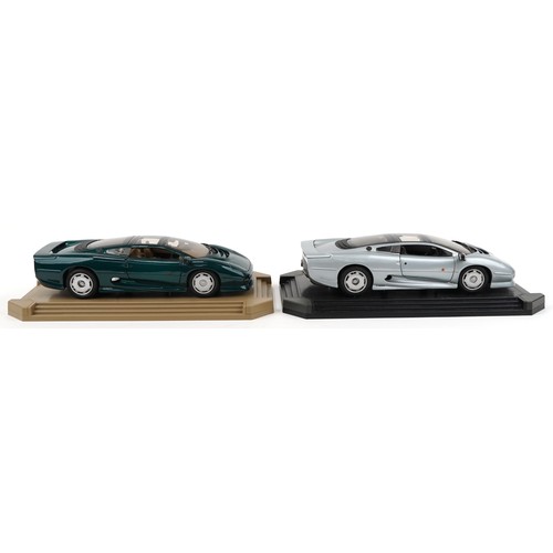 2324 - Two Maisto Jaguar XJ220 1:12 scale diecast vehicles on display stands,