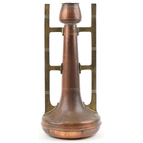 493 - Arts & Crafts stylized copper vase with brass handles, 55cm high