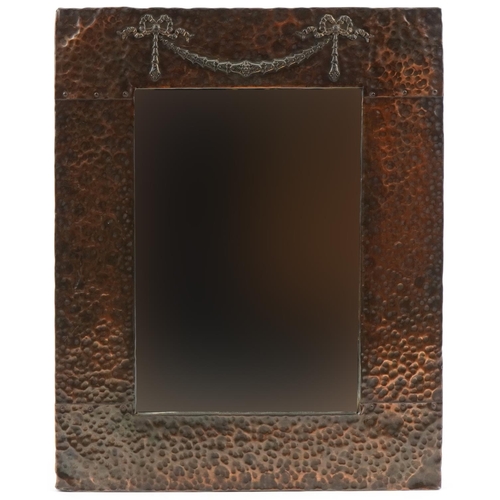 137 - Arts & Crafts copper mirror with bow and swag design, 50cm x 42cm