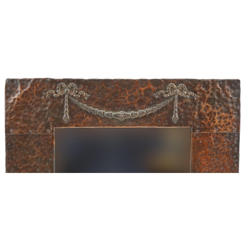 137 - Arts & Crafts copper mirror with bow and swag design, 50cm x 42cm