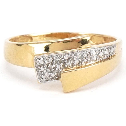 3438 - 18ct two tone gold diamond crossover ring, size Q, 2.7g