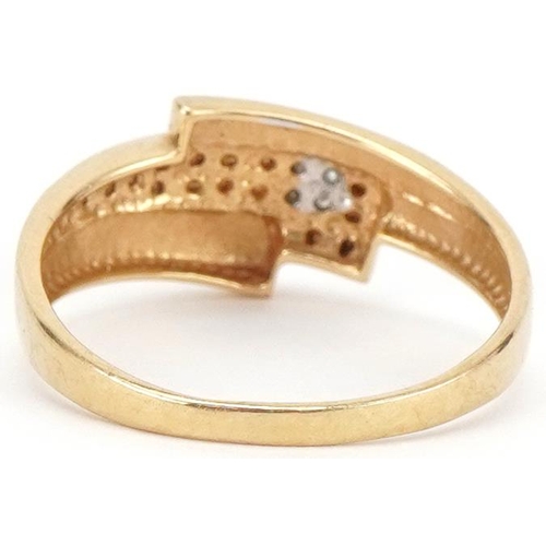 3438 - 18ct two tone gold diamond crossover ring, size Q, 2.7g