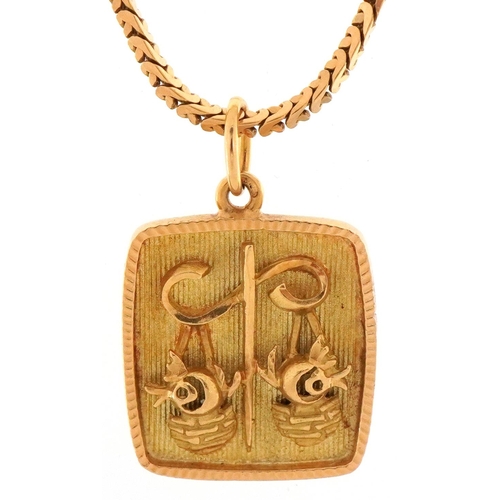 3135 - Yellow metal Libra zodiac pendant on a yellow metal necklace, indistinct marks to the clasp, 2.5cm h... 