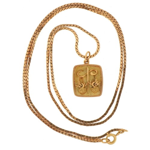 3135 - Yellow metal Libra zodiac pendant on a yellow metal necklace, indistinct marks to the clasp, 2.5cm h... 